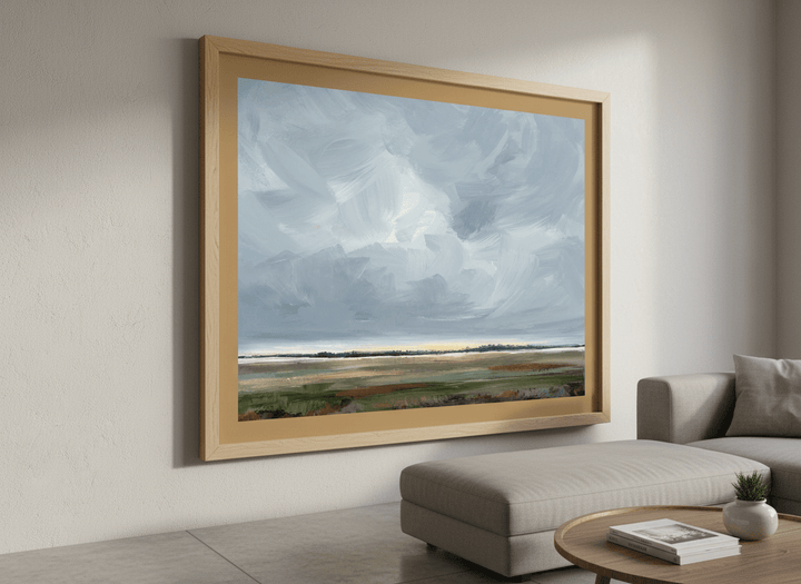 Modern wall art styled above a sofa in a neutral living room