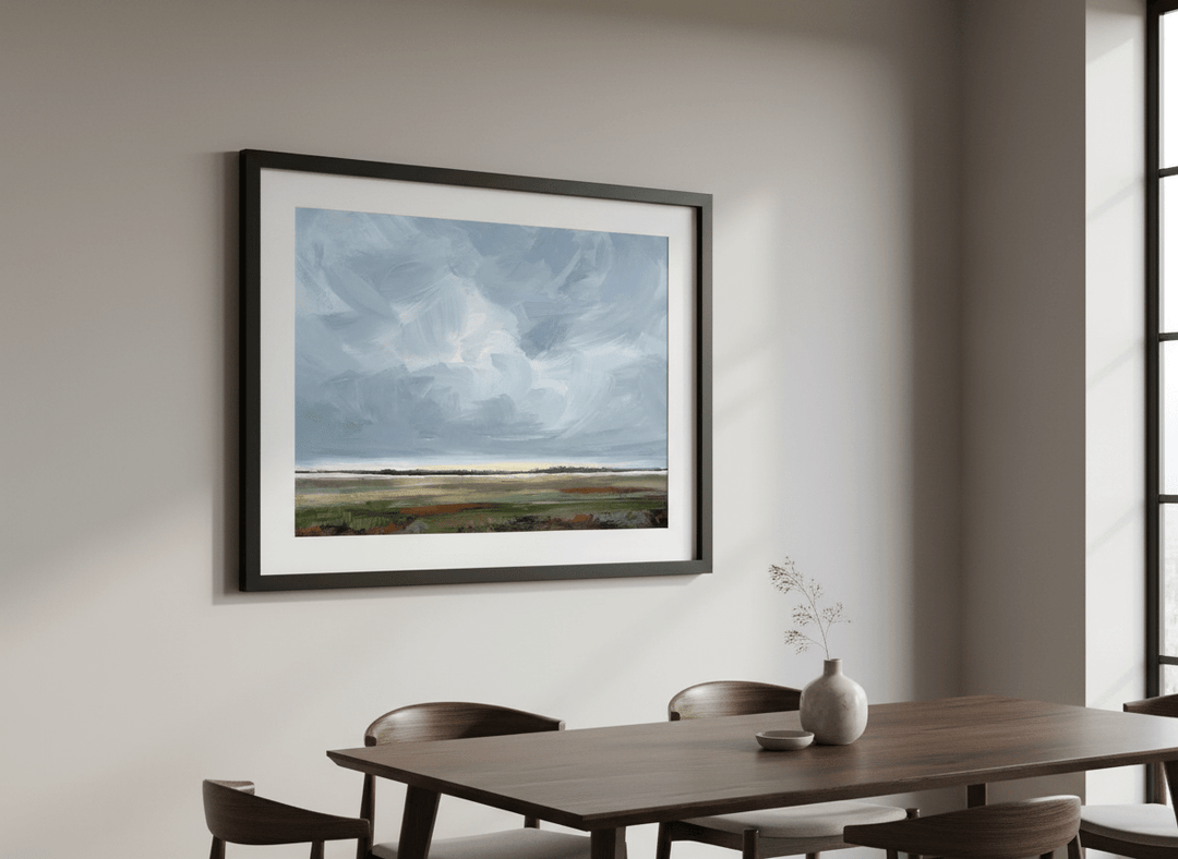 Wall art styled above a dining table in a contemporary home