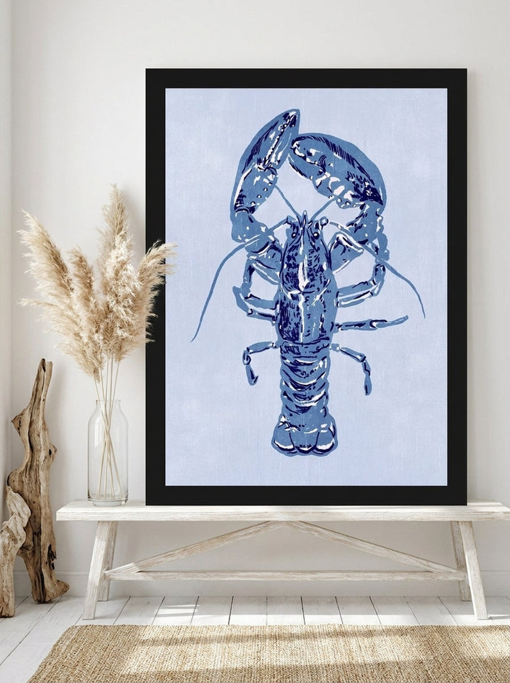 Modern wall art print standing on a console in a coastal living room