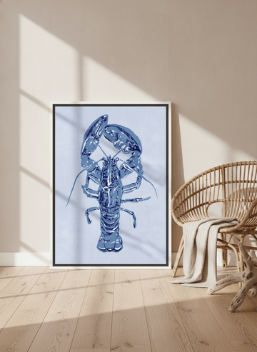 Canvas wall art with a white surround leaning against the wall in a coastal dining room