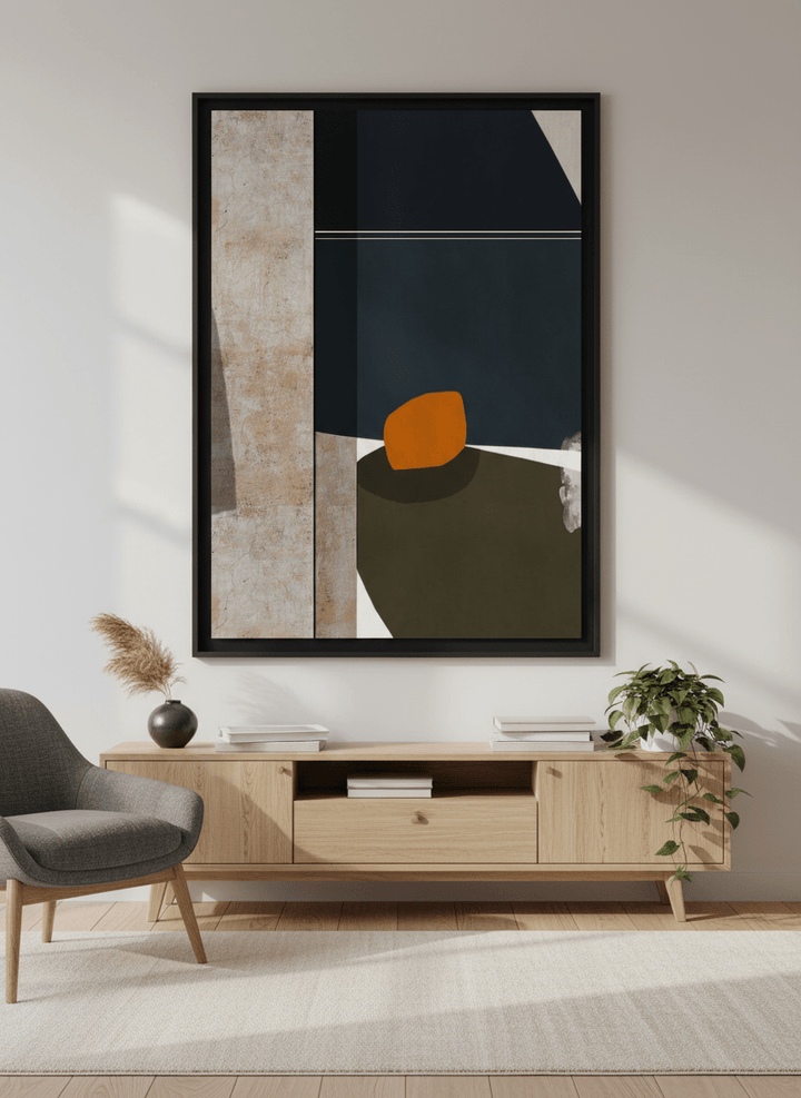 Modern wall art styled above a sofa in a neutral living room