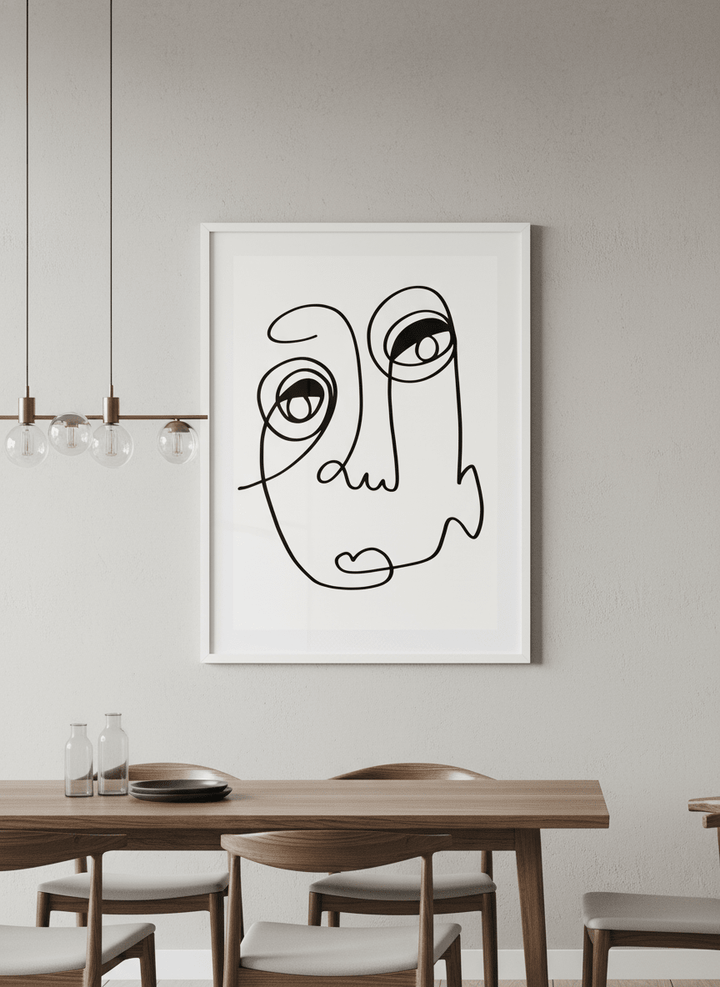 Wall art styled above a dining table in a contemporary home