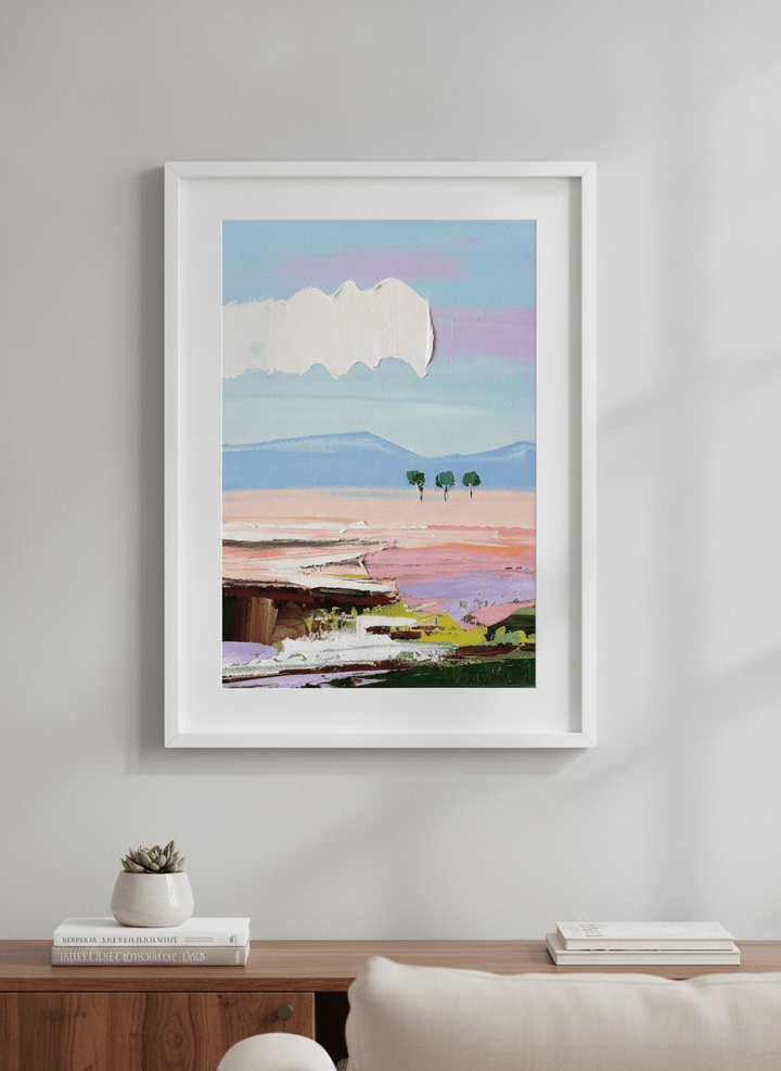 Modern wall art styled above a sofa in a neutral living room