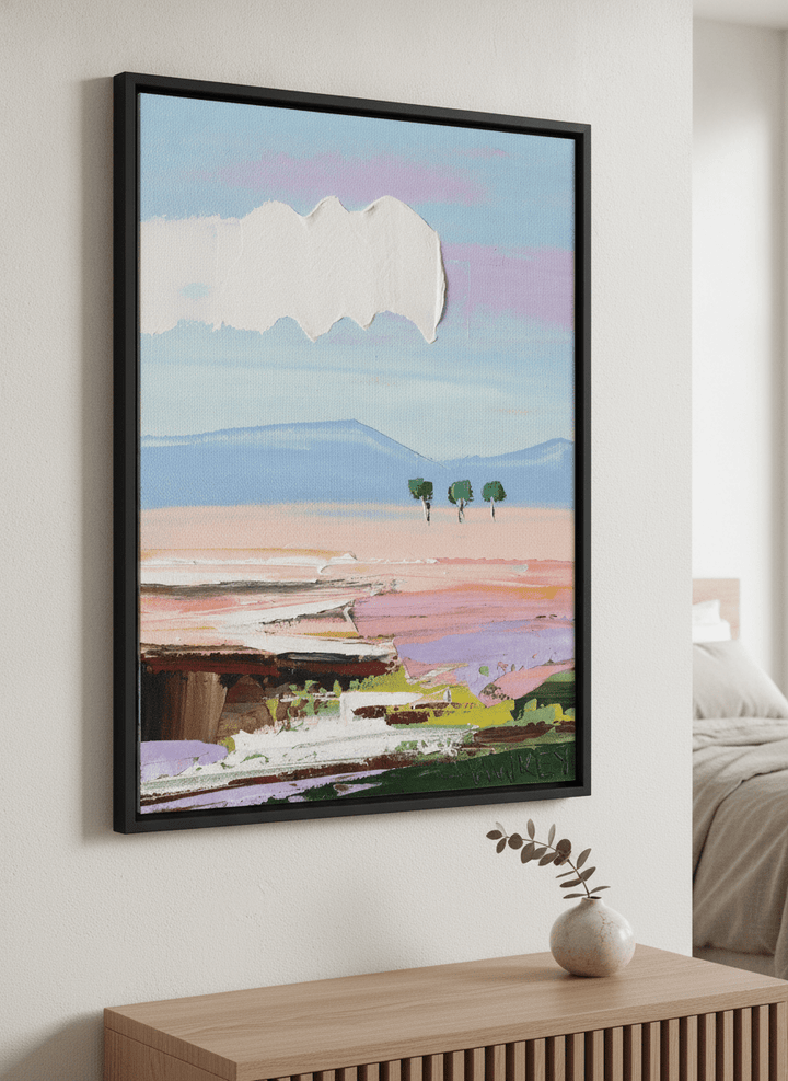 Minimalist artwork displayed in a calm, light-filled bedroom interior