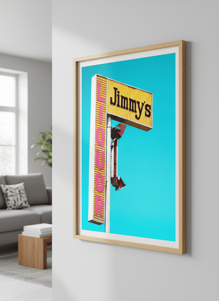 Modern wall art styled above a sofa in a neutral living room