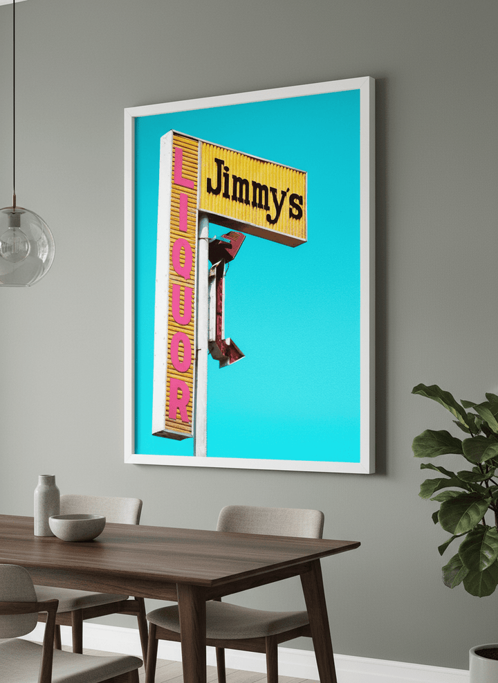 Wall art styled above a dining table in a contemporary home