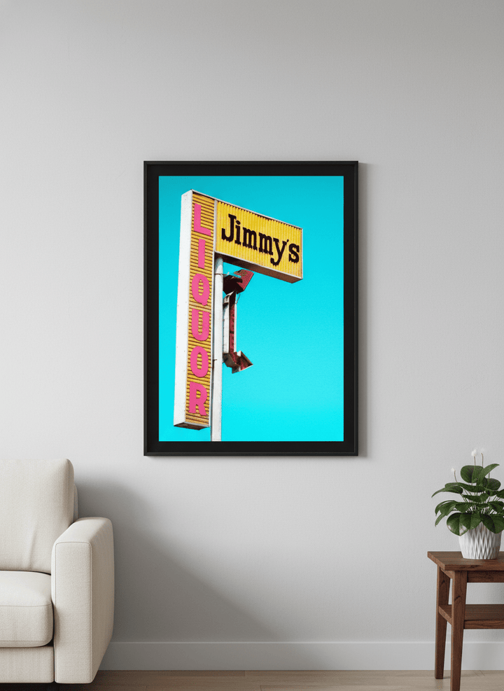 Modern wall art styled above a sofa in a neutral living room