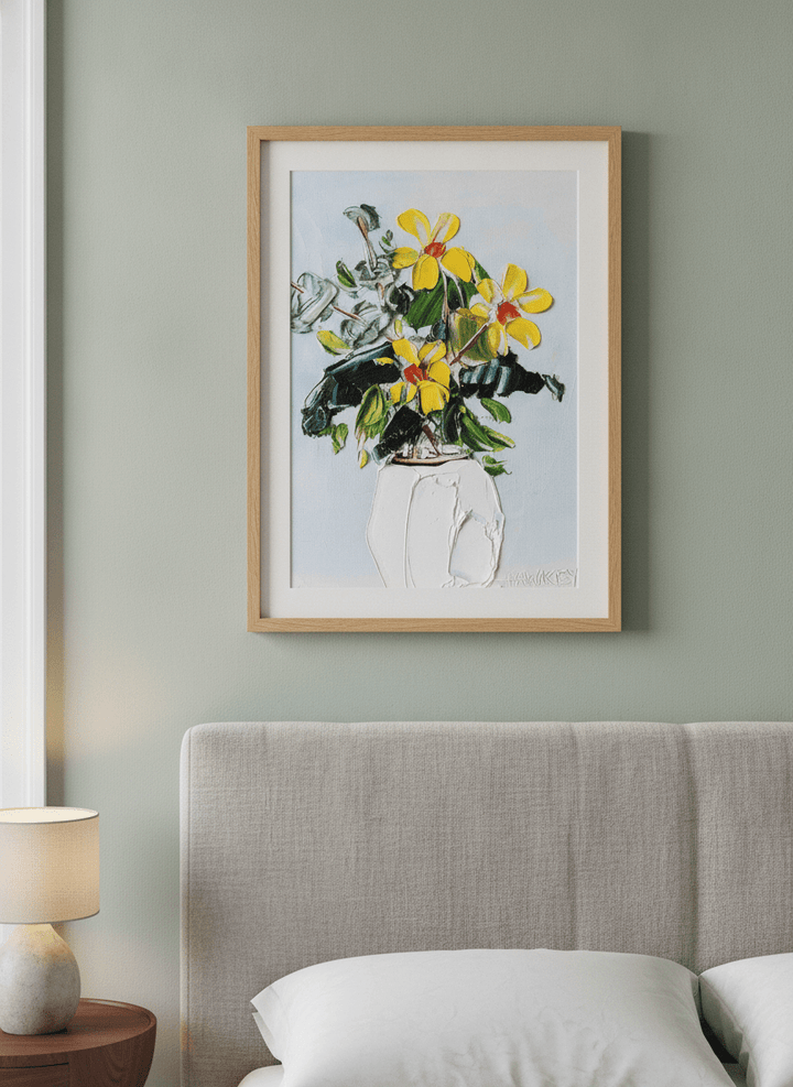 Minimalist artwork displayed in a calm, light-filled bedroom interior