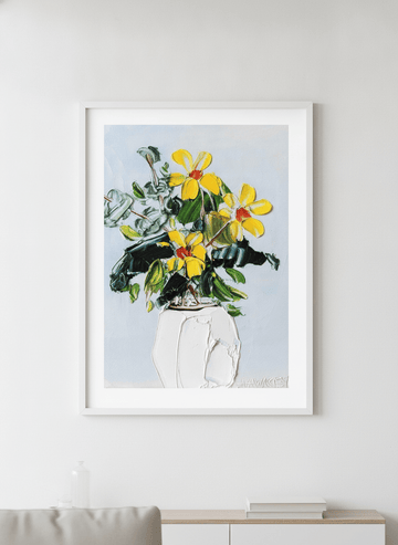 Modern wall art styled above a sofa in a neutral living room