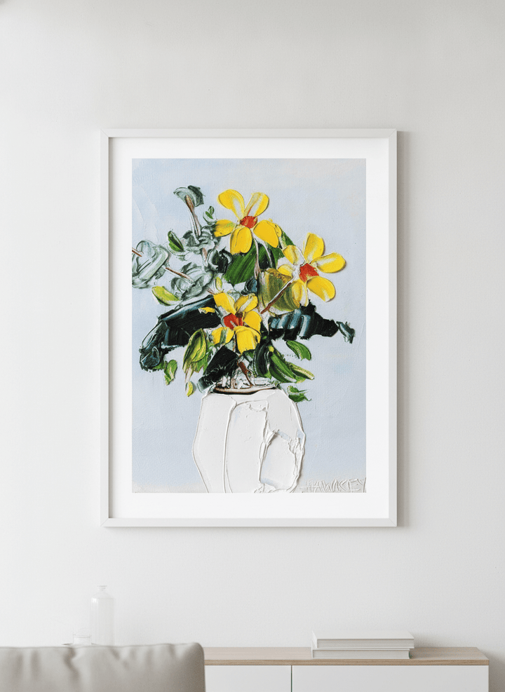 Modern wall art styled above a sofa in a neutral living room