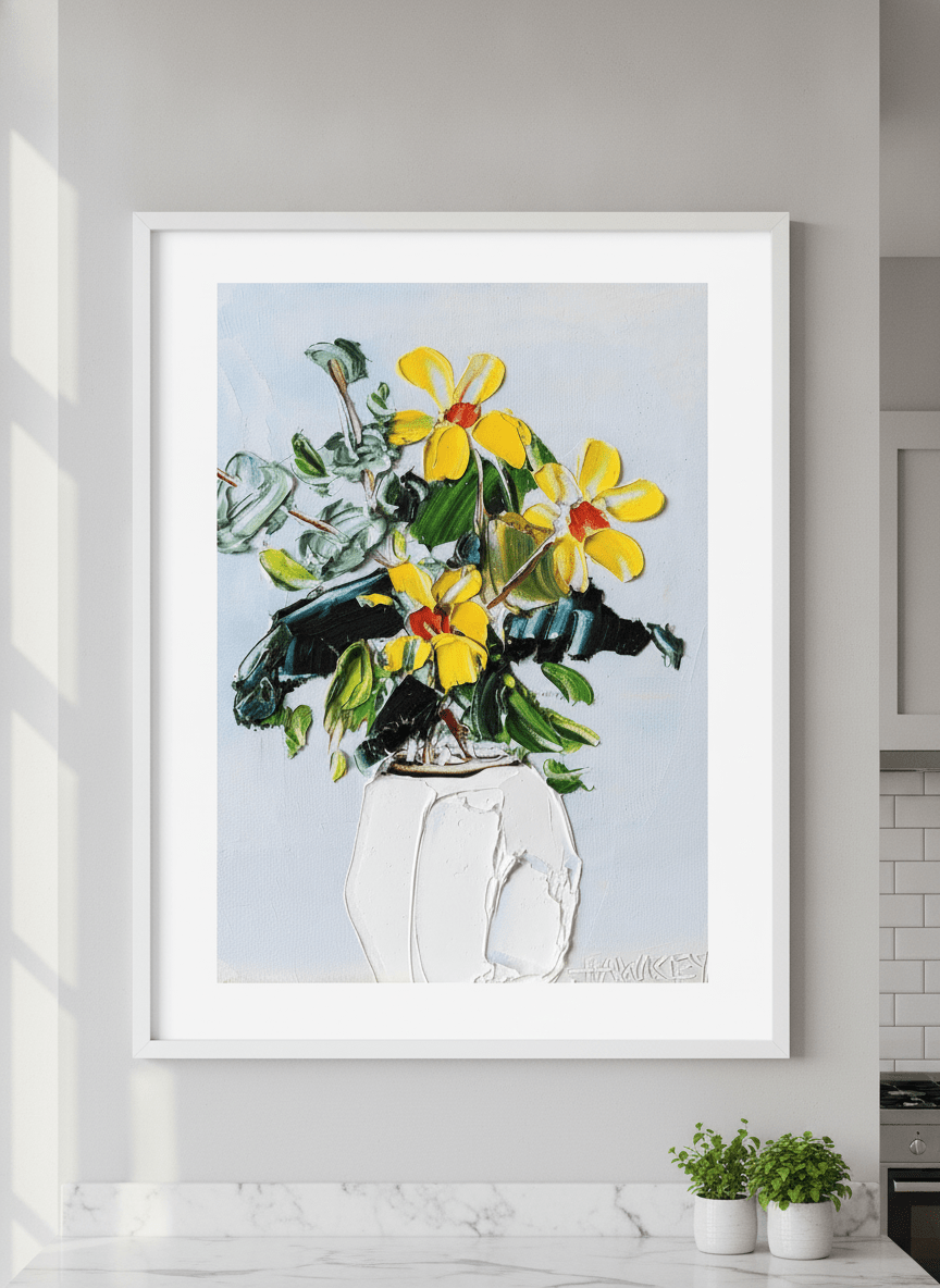 Artwork styled on the wall of a bright modern kitchen