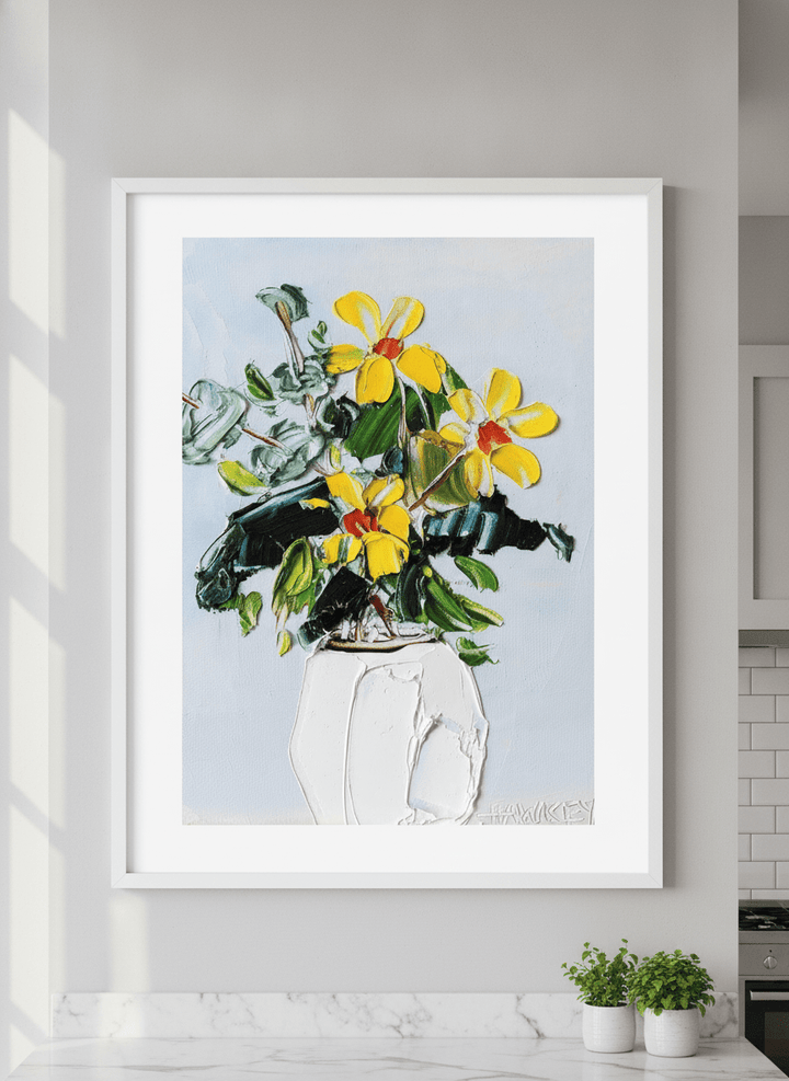 Artwork styled on the wall of a bright modern kitchen