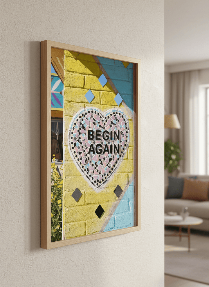 Modern wall art styled above a sofa in a neutral living room