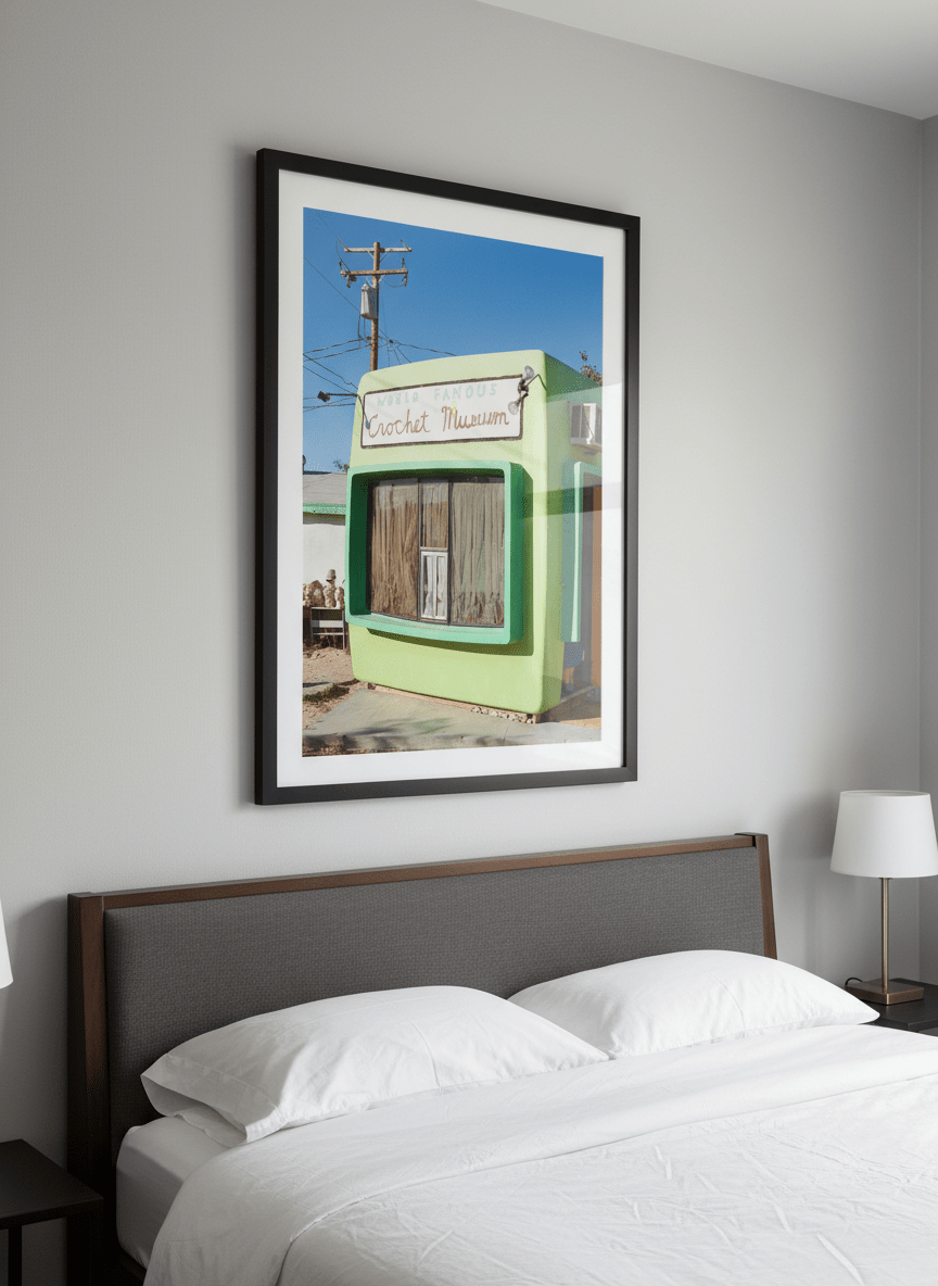Minimalist artwork displayed in a calm, light-filled bedroom interior
