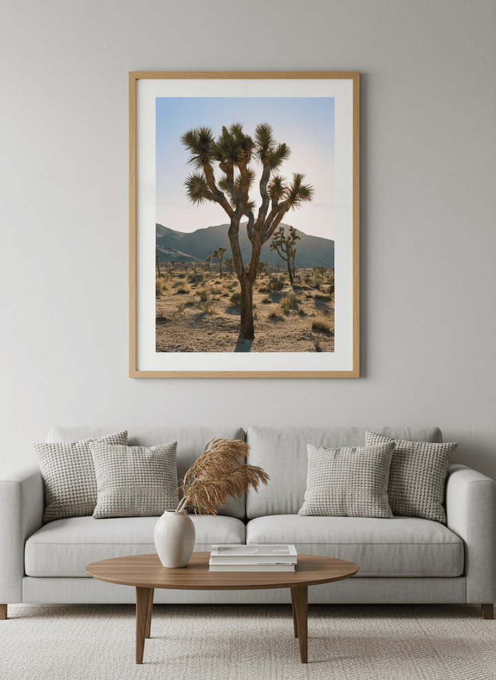 Modern wall art styled above a sofa in a neutral living room
