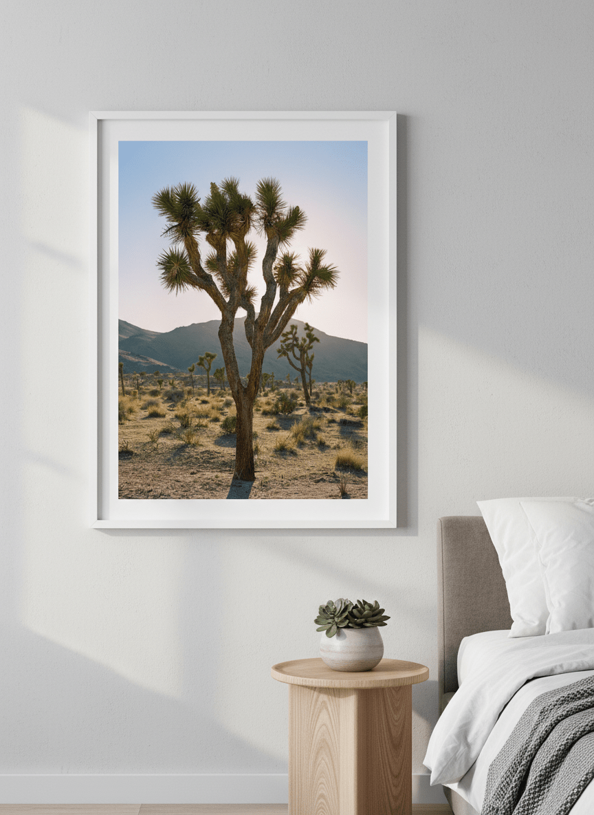 Minimalist artwork displayed in a calm, light-filled bedroom interior