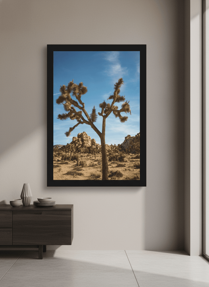 Wall art styled above a dining table in a contemporary home