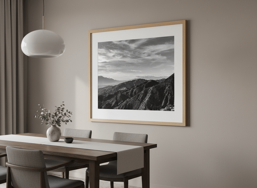 Wall art styled above a dining table in a contemporary home
