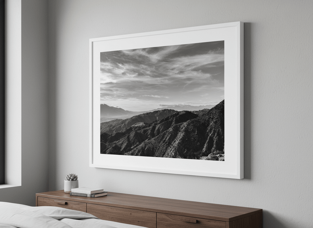Minimalist artwork displayed in a calm, light-filled bedroom interior