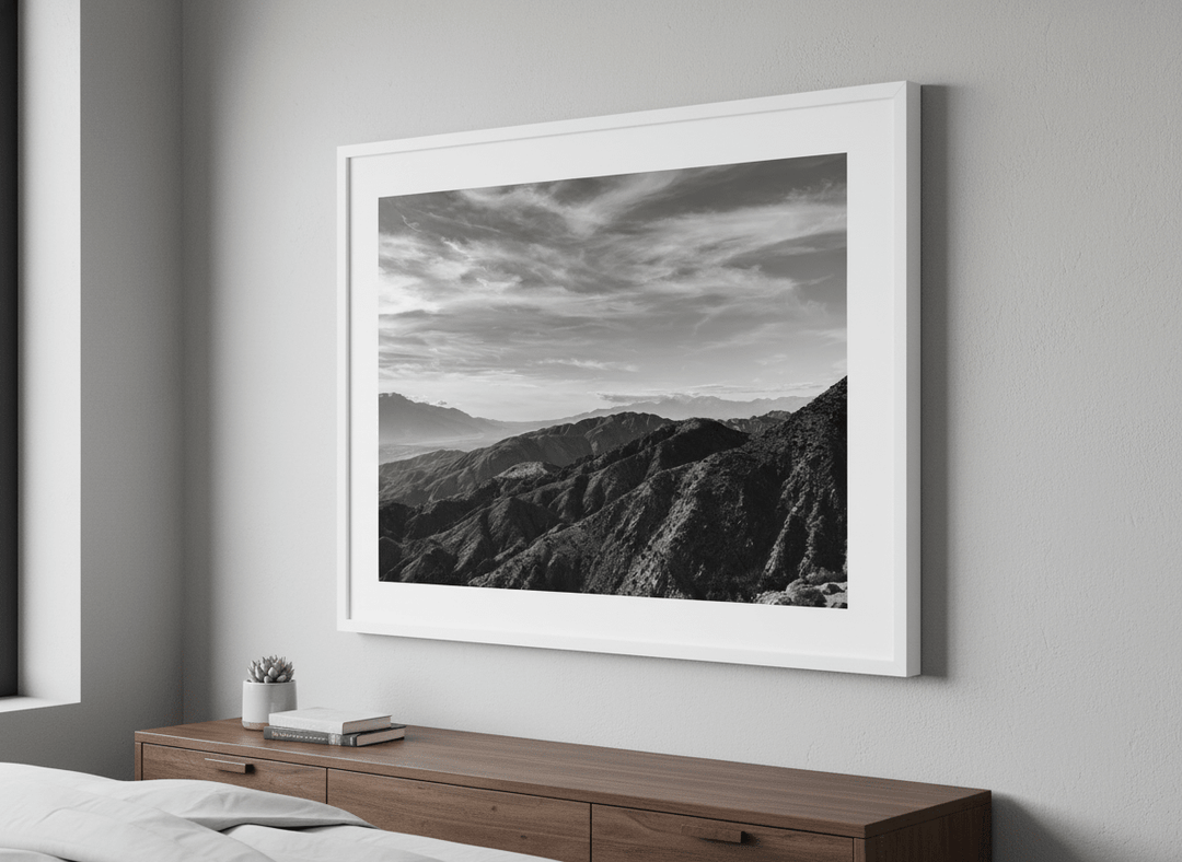 Minimalist artwork displayed in a calm, light-filled bedroom interior