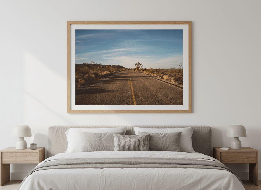 Minimalist artwork displayed in a calm, light-filled bedroom interior