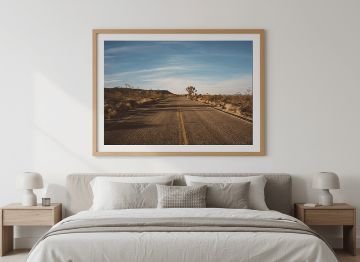 Minimalist artwork displayed in a calm, light-filled bedroom interior