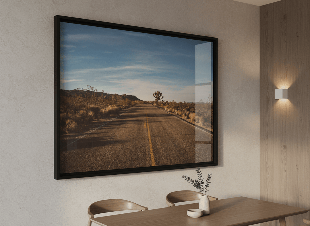 Wall art styled above a dining table in a contemporary home