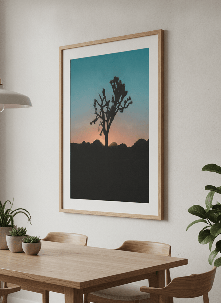 Wall art styled above a dining table in a contemporary home