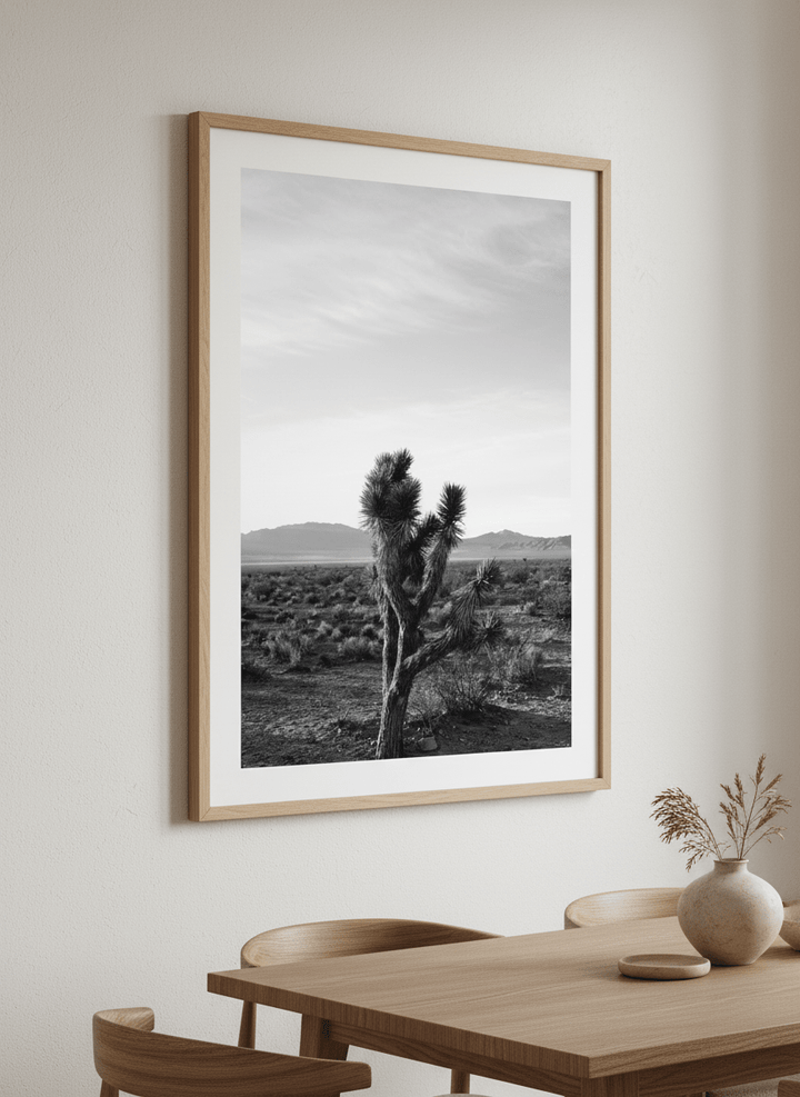 Wall art styled above a dining table in a contemporary home
