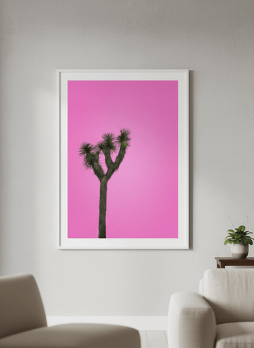 Modern wall art styled above a sofa in a neutral living room