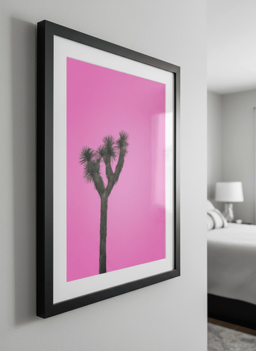 Minimalist artwork displayed in a calm, light-filled bedroom interior