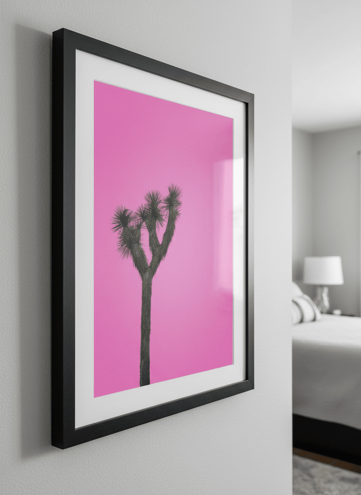 Minimalist artwork displayed in a calm, light-filled bedroom interior