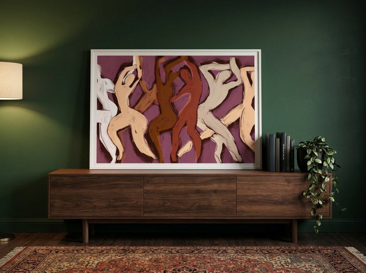 Modern wall art print standing on a sideboard in a moody home office