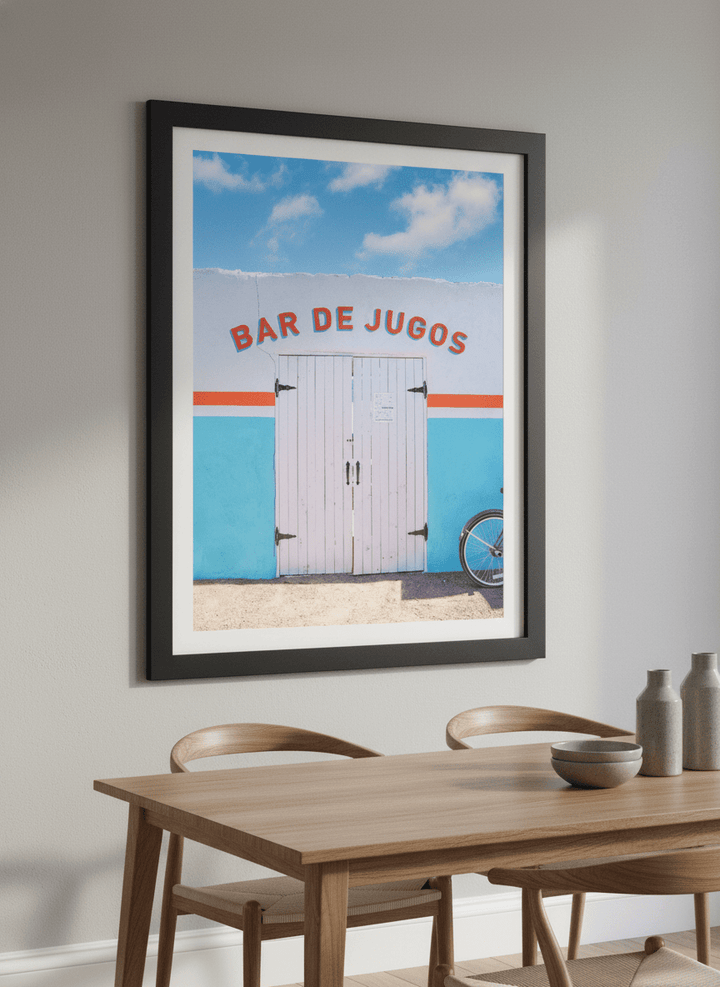Wall art styled above a dining table in a contemporary home