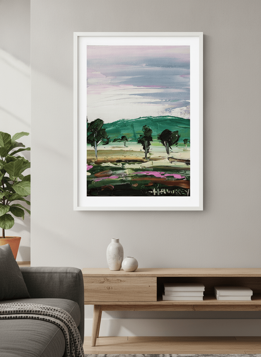 Modern wall art styled above a sofa in a neutral living room