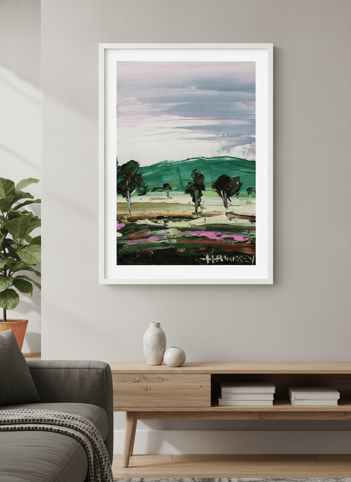 Modern wall art styled above a sofa in a neutral living room