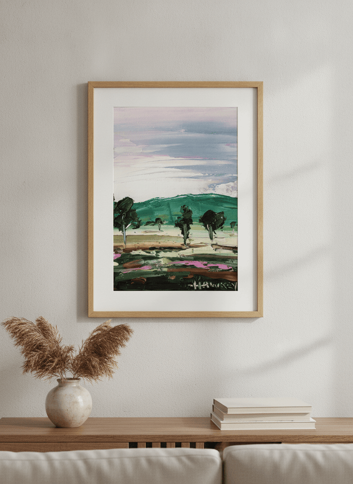 Modern wall art styled above a sofa in a neutral living room