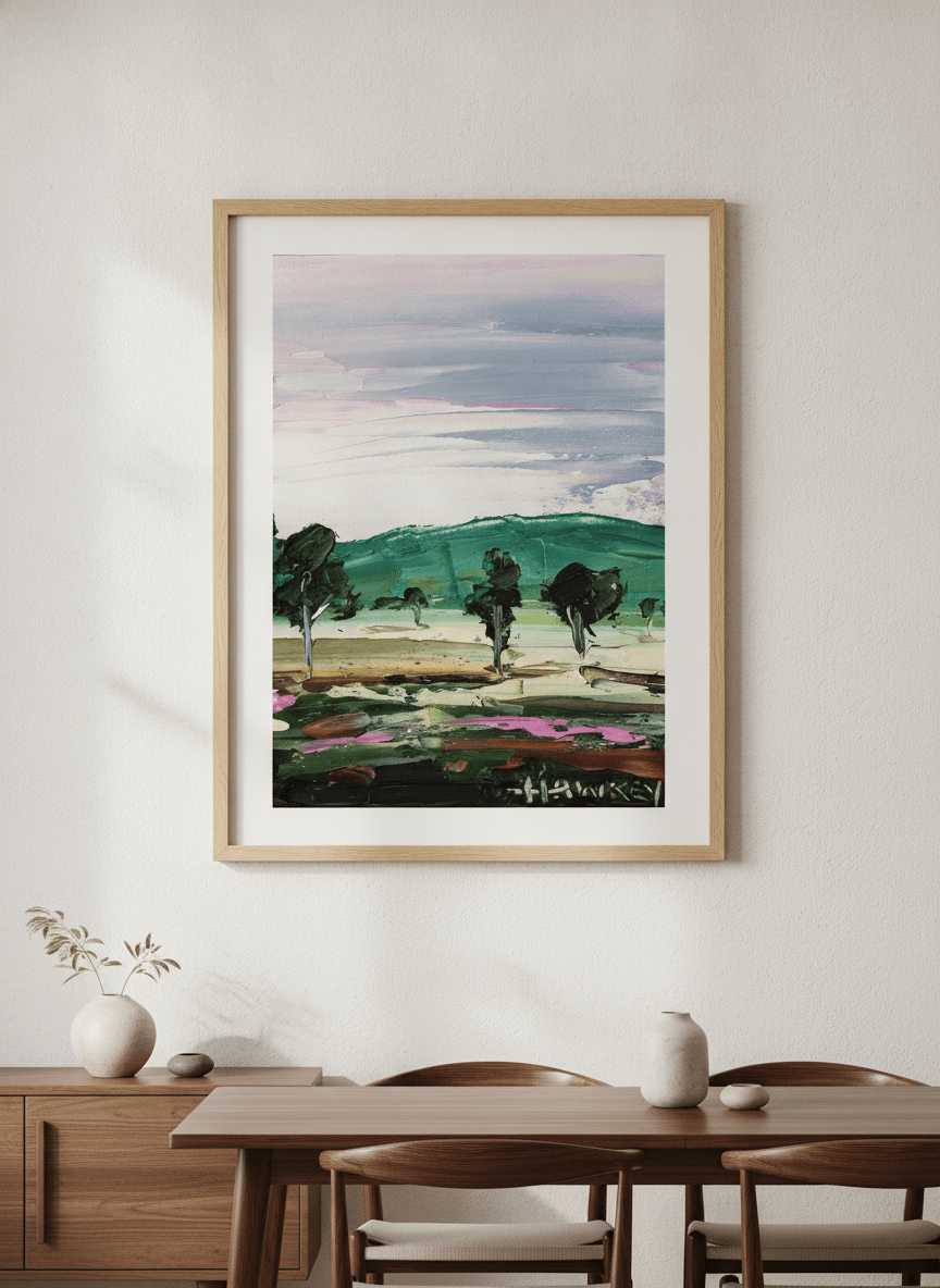 Wall art styled above a dining table in a contemporary home