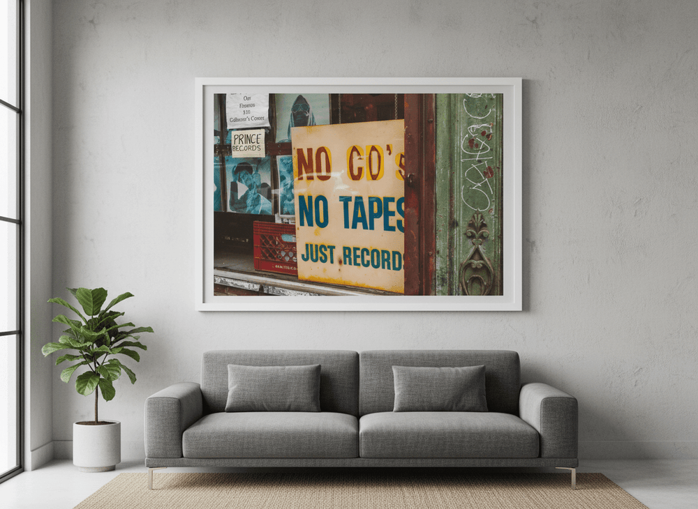 Modern wall art styled above a sofa in a neutral living room