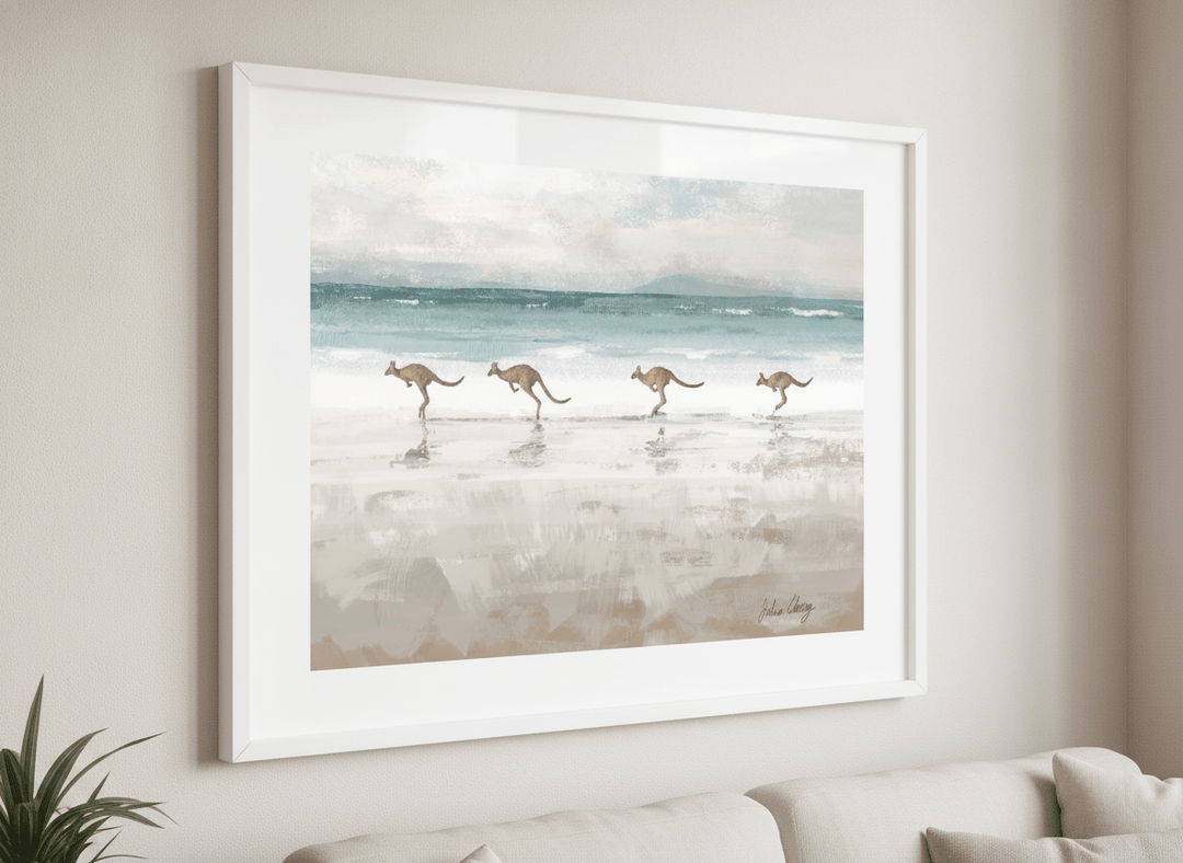 Modern wall art styled above a sofa in a neutral living room