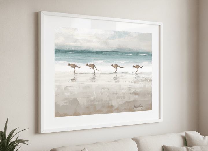 Modern wall art styled above a sofa in a neutral living room