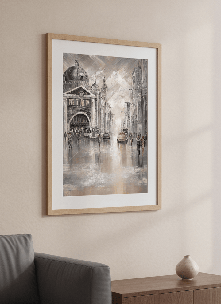 Modern wall art styled above a sofa in a neutral living room