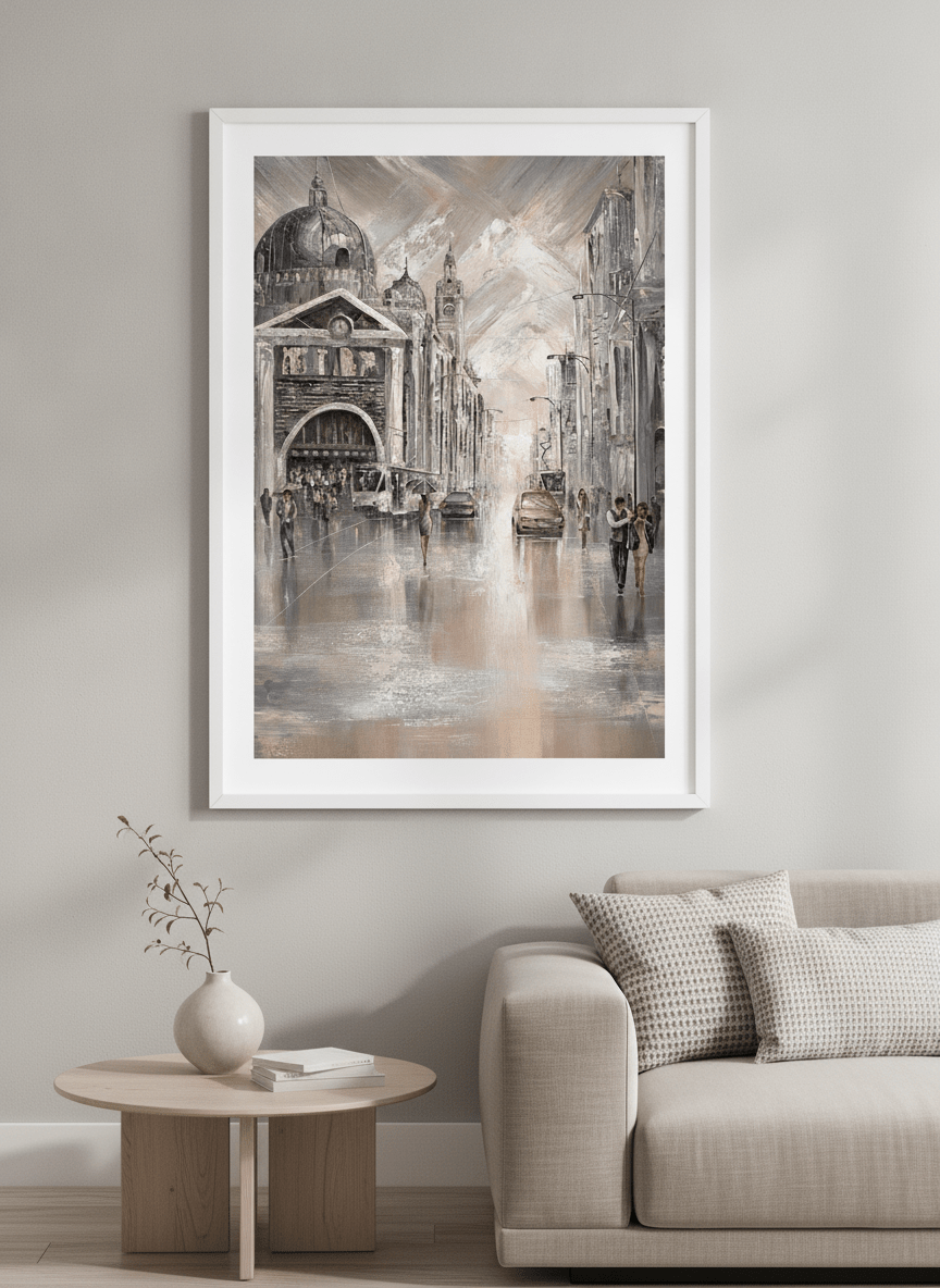 Modern wall art styled above a sofa in a neutral living room