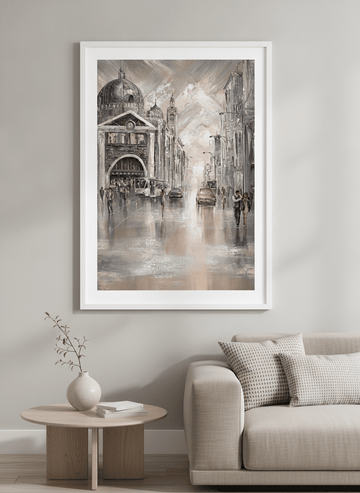Modern wall art styled above a sofa in a neutral living room