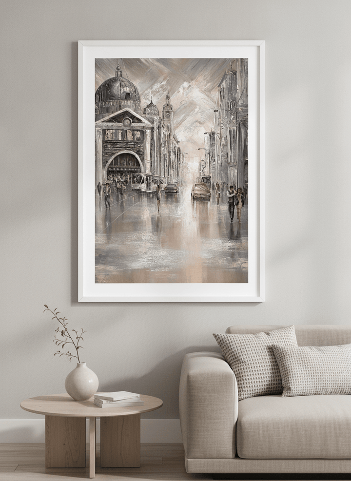 Modern wall art styled above a sofa in a neutral living room