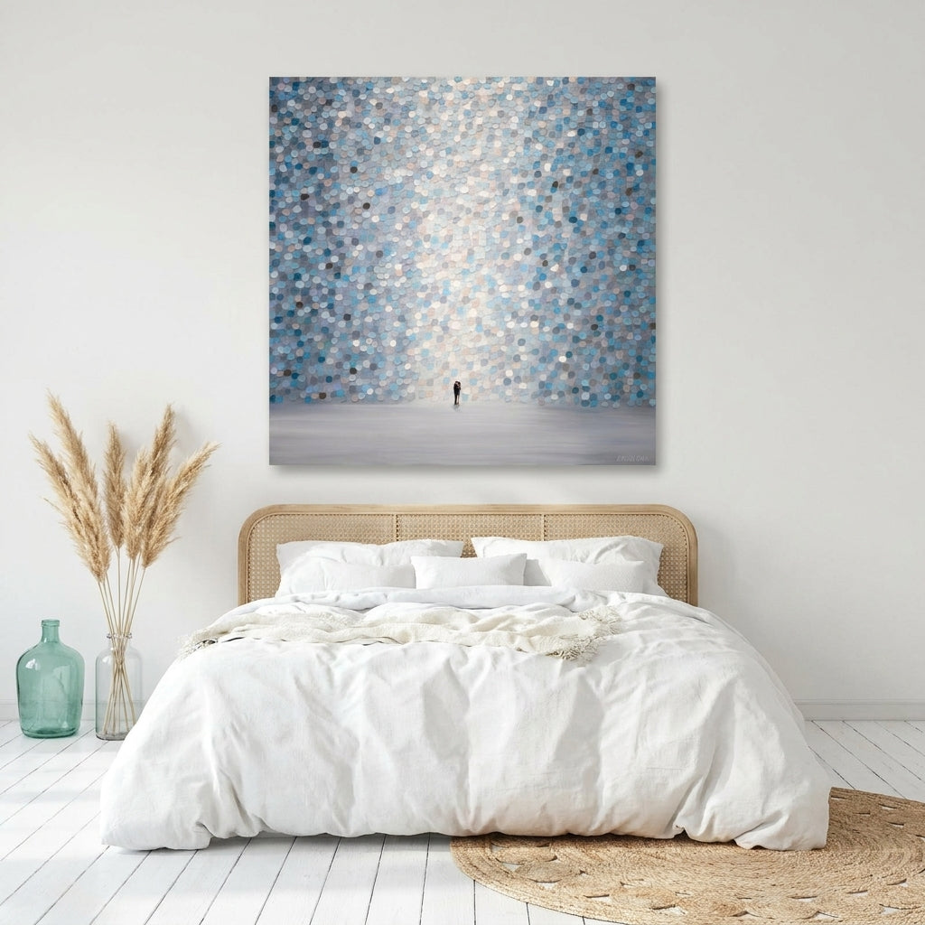 Stretched canvas wall art styled on the wall in a coastal bedroom