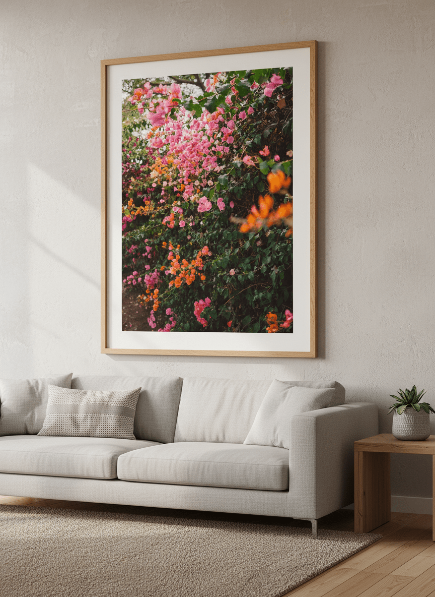 Modern wall art styled above a sofa in a neutral living room