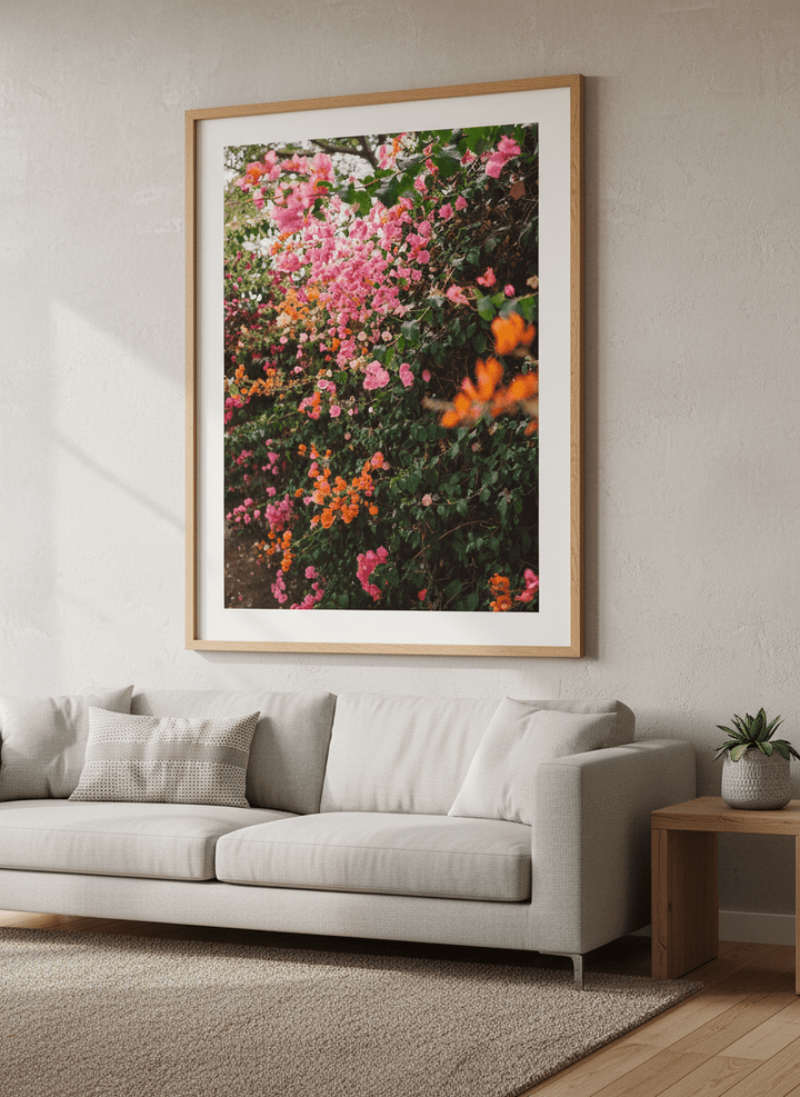 Modern wall art styled above a sofa in a neutral living room