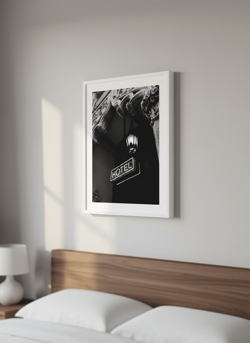 Minimalist artwork displayed in a calm, light-filled bedroom interior