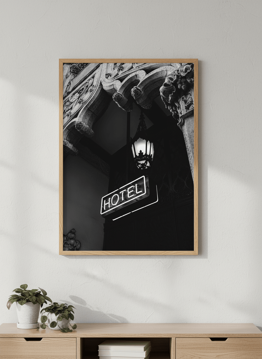Modern wall art styled above a sofa in a neutral living room